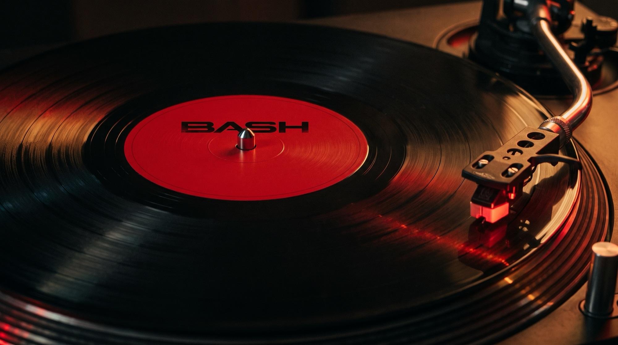 Needle drop frame: black vinyl with the red BASH label, tonearm lowered onto the grooves